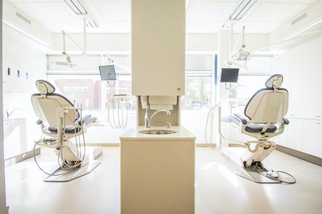 Two dental chairs in dental office.