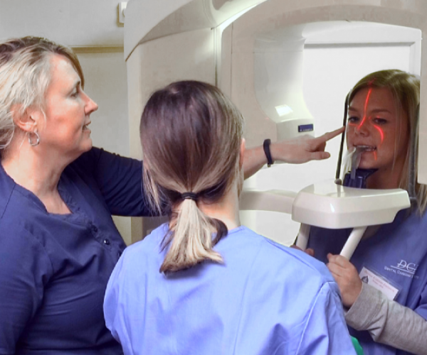 students and teacher using x-ray machine